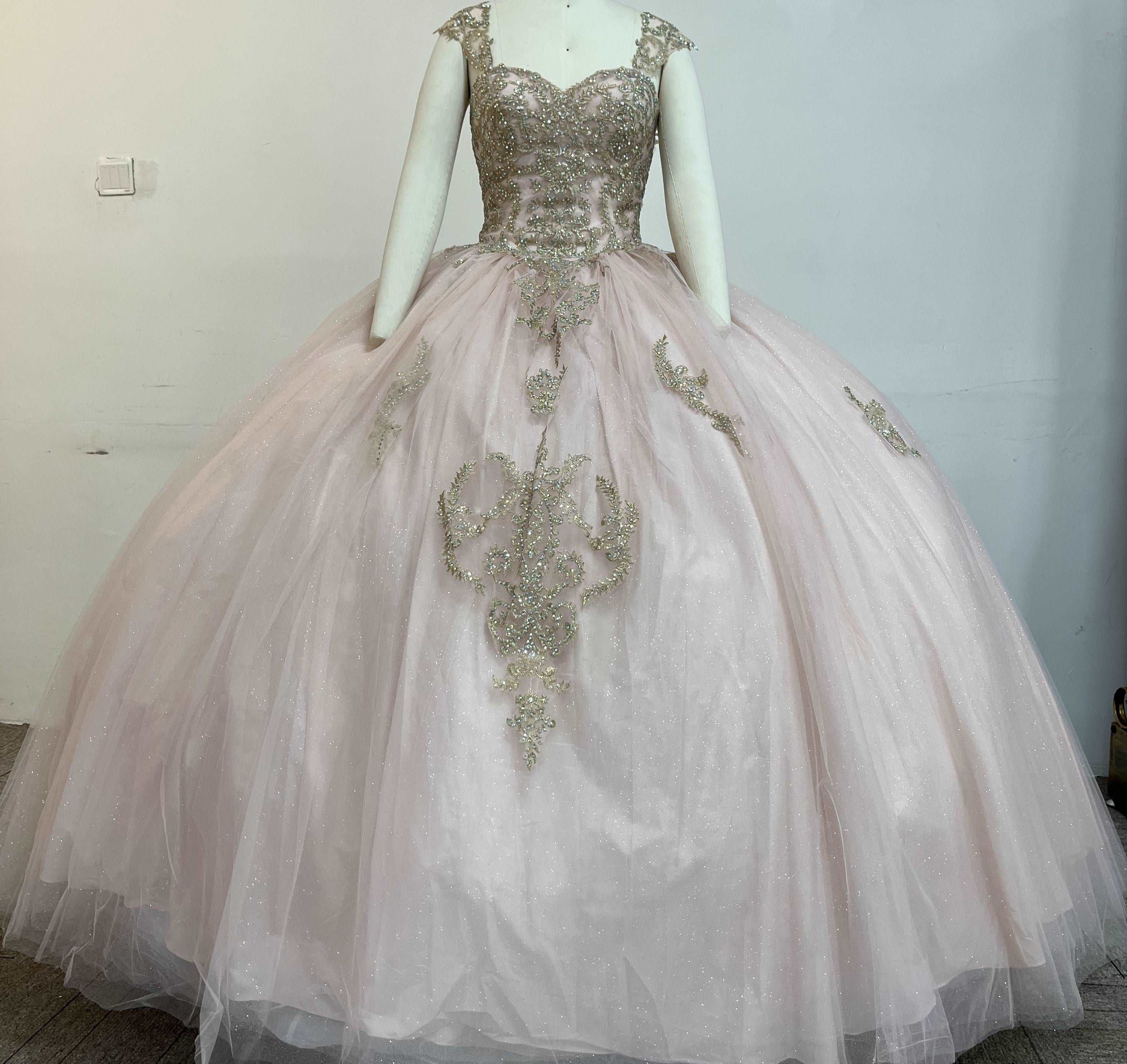 A beautiful gown, off-shoulder, reveals noble air.