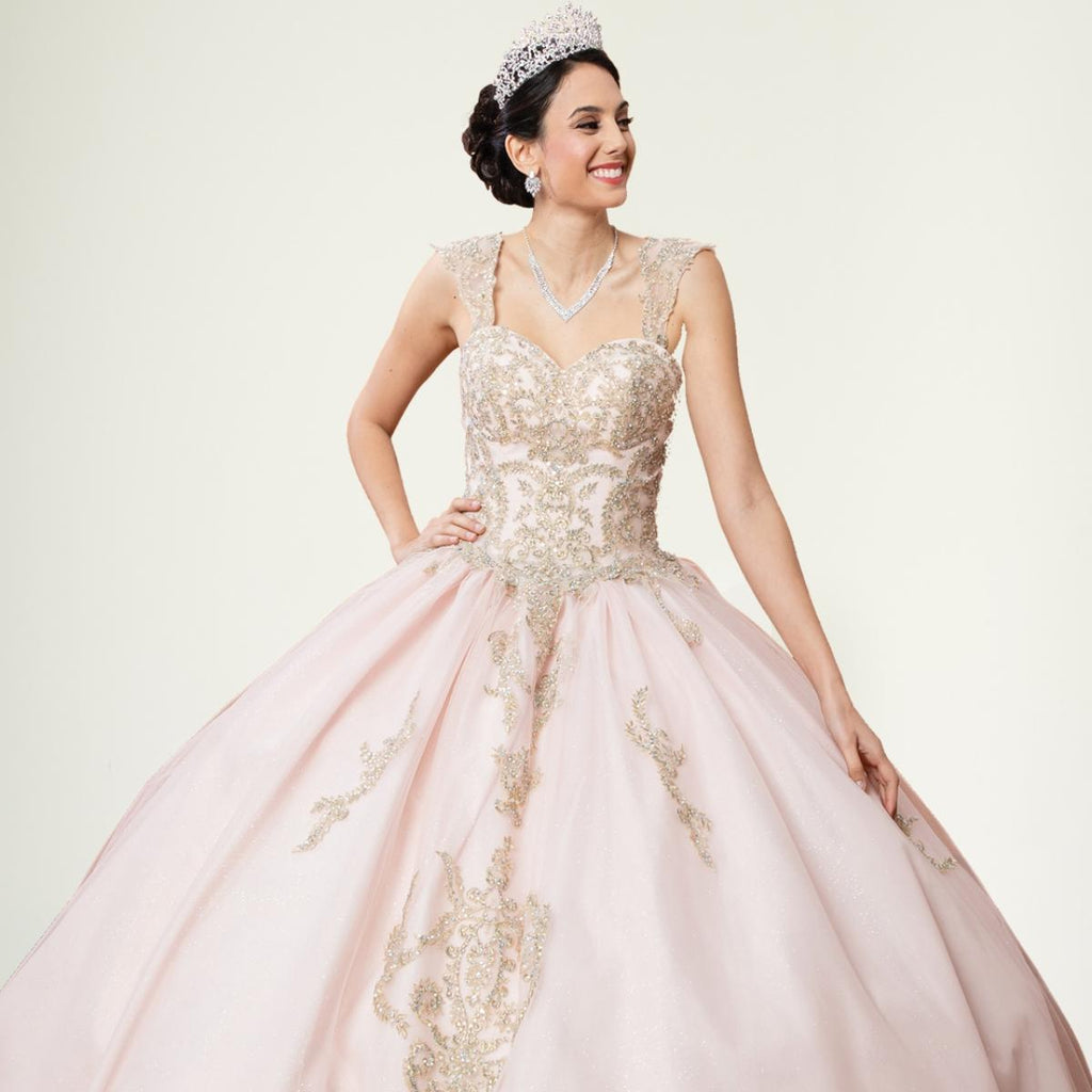 A beautiful gown, off-shoulder, reveals noble air.