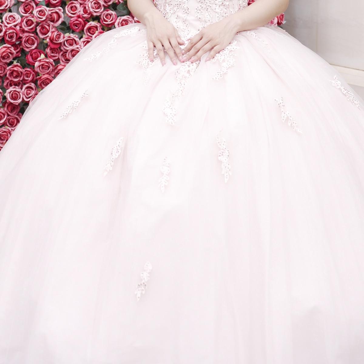 Adults in gowns, flowing skirts, confident display.