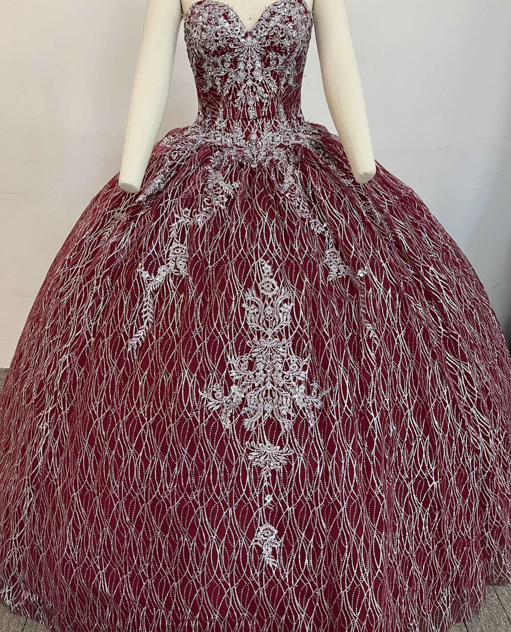 A beautiful gown, off-shoulder, reveals noble air.