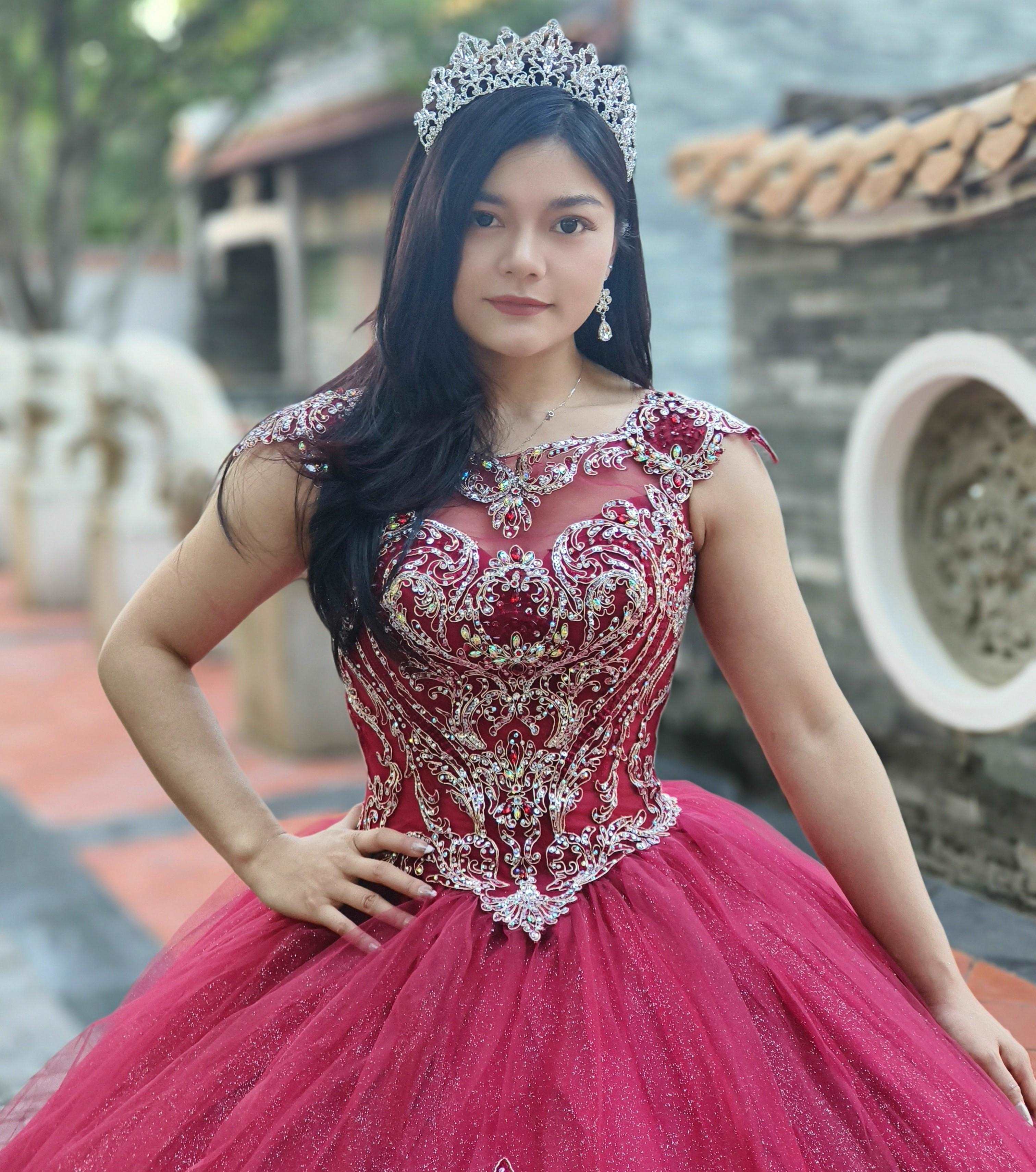 A beautiful gown, off-shoulder, reveals noble air.