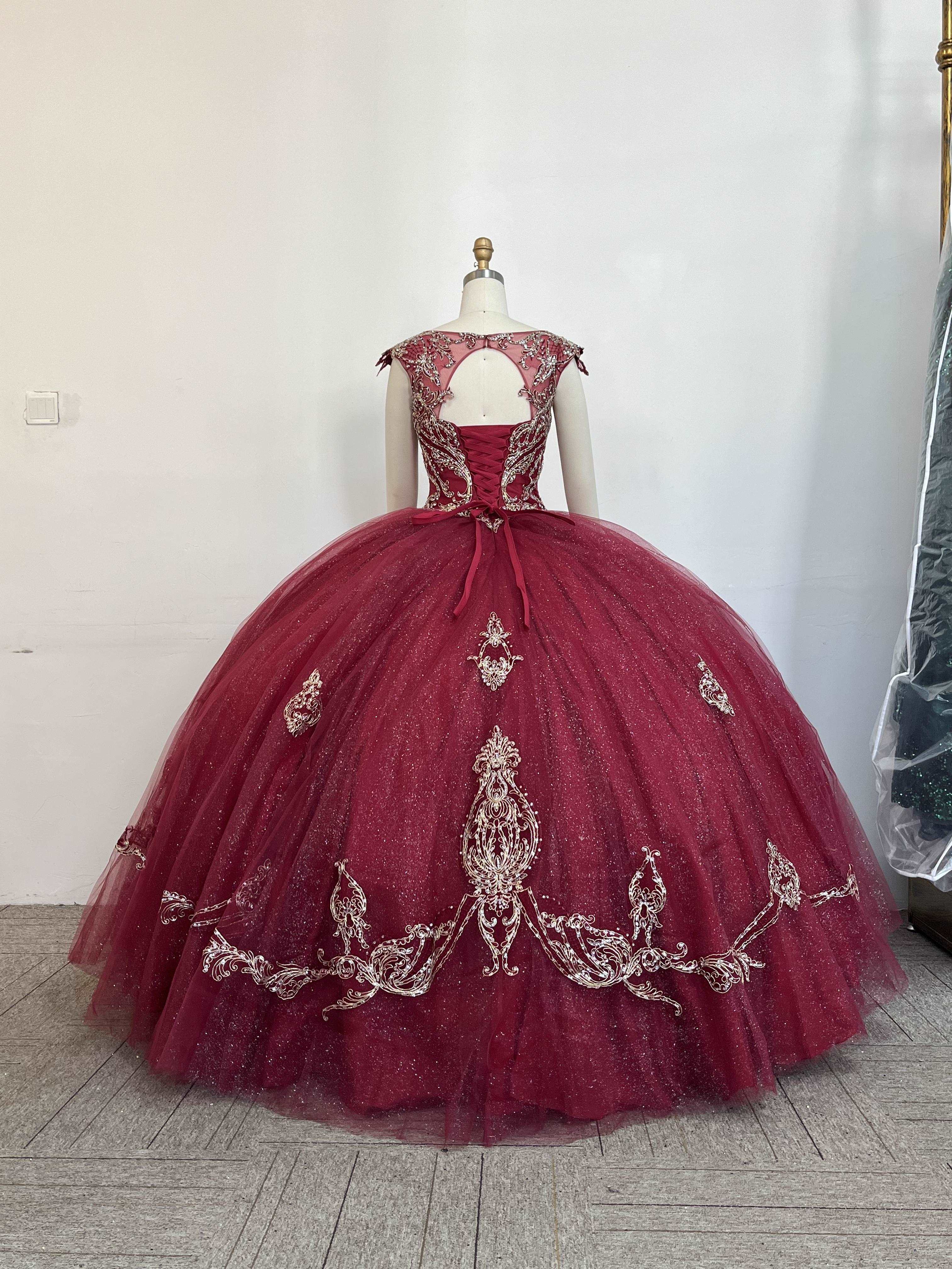 A beautiful gown, off-shoulder, reveals noble air.