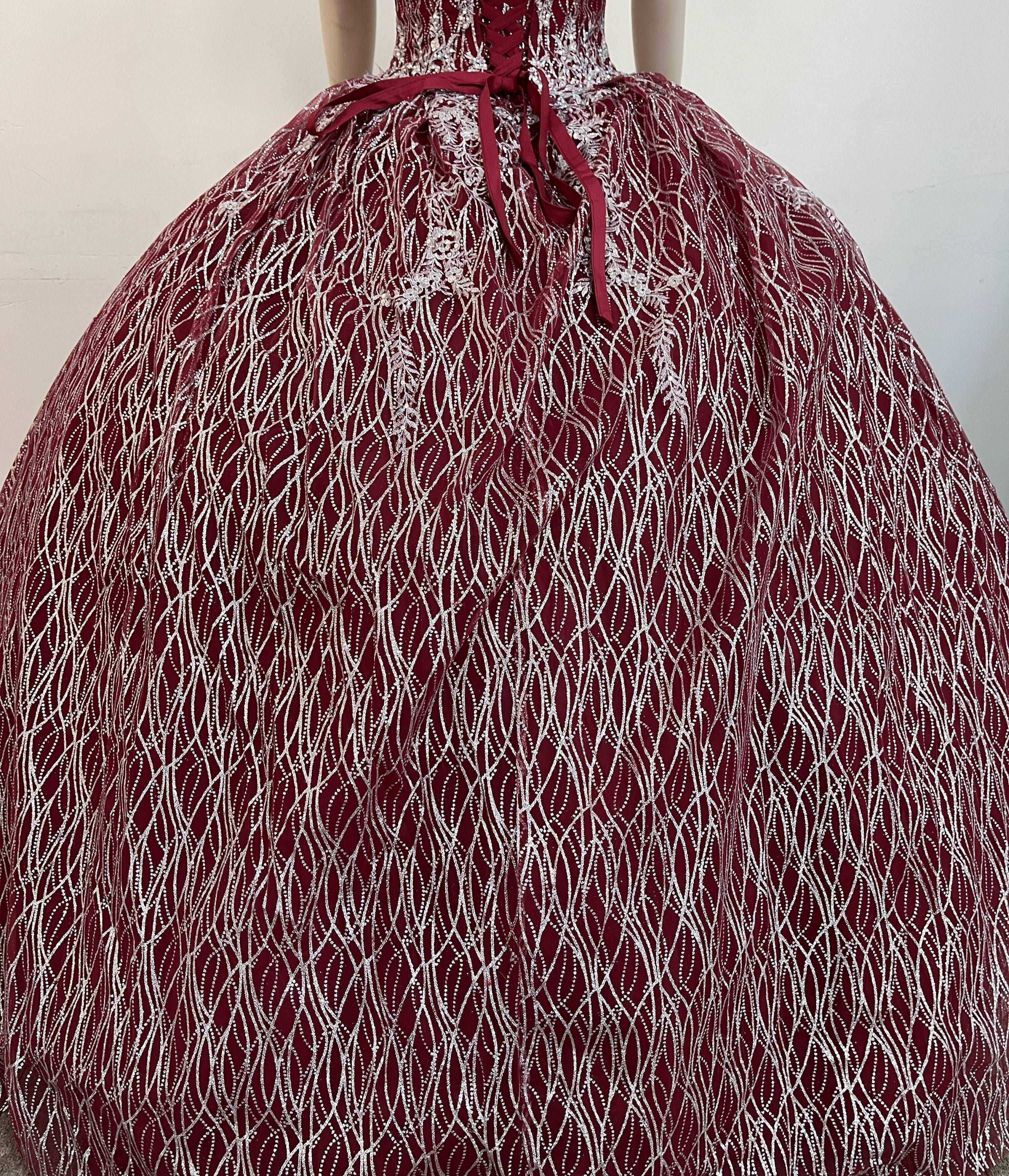 A beautiful gown, off-shoulder, reveals noble air.