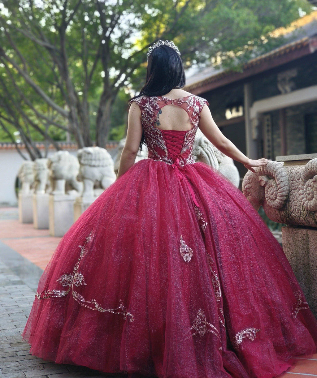 A beautiful gown, off-shoulder, reveals noble air.