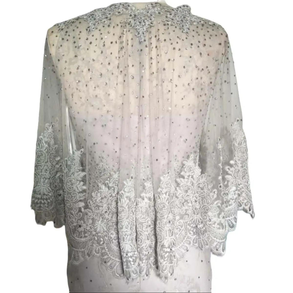 A beautiful gown, off-shoulder, reveals noble air.