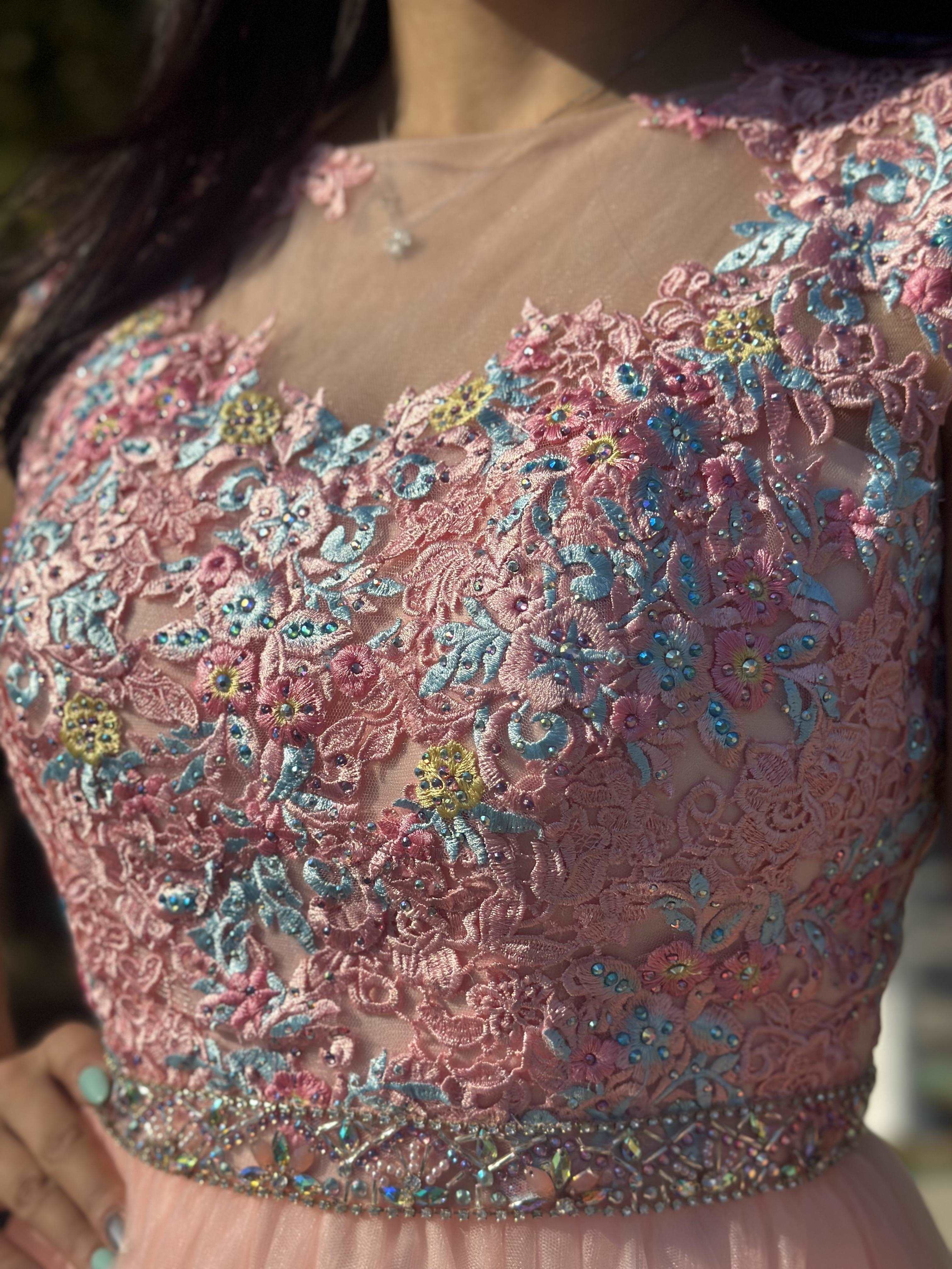 A beautiful gown, off-shoulder, reveals noble air.