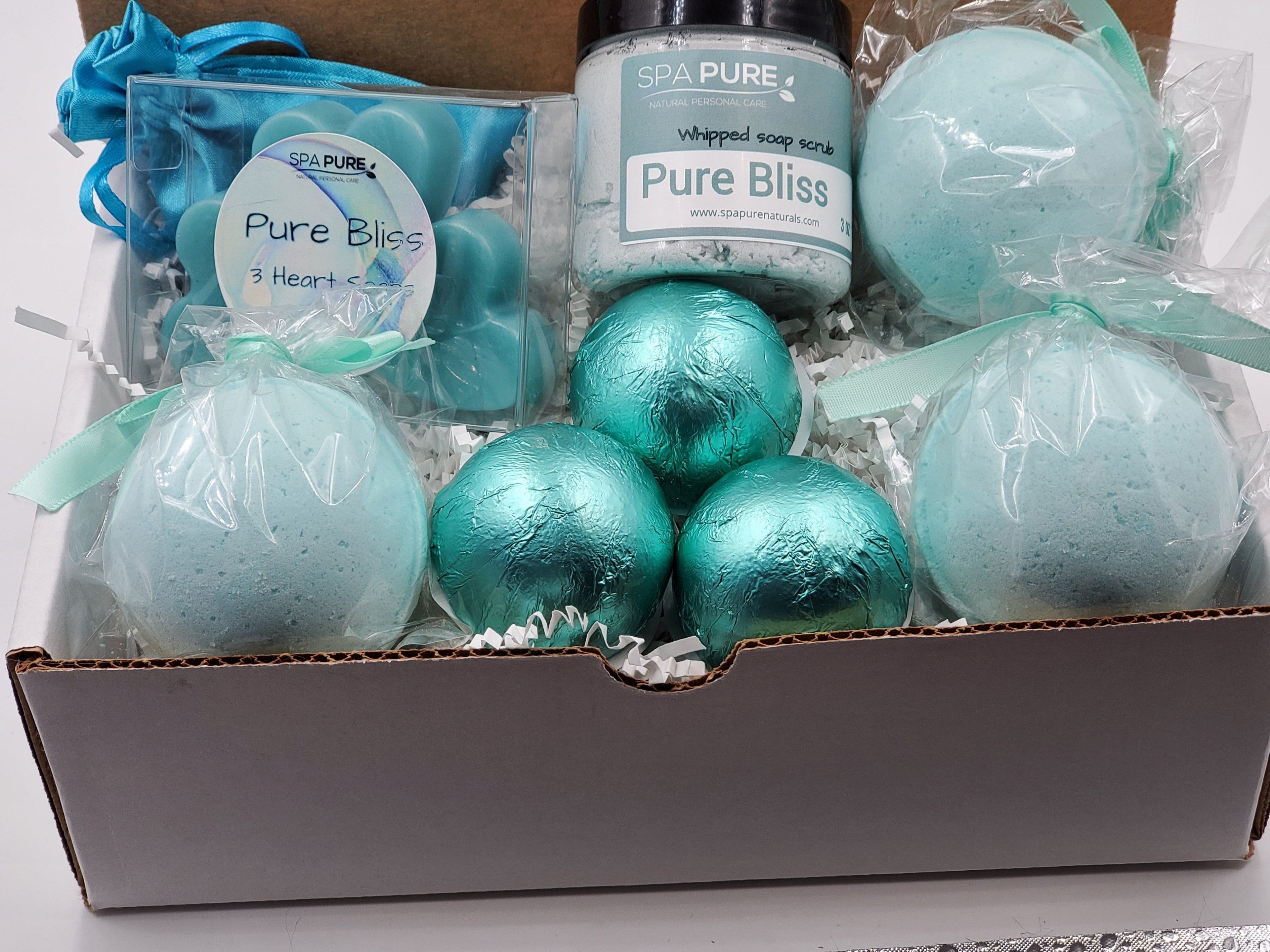 Spa Pure Luxury Spa Kit - Pure Bliss - 3 XL Pure Bliss Bath Fizzies, 3 Pure Bliss shower steamers, 3 Heart-shaped soaps, one 3.5 oz Pure Bliss whipped soap scrub, 1 Roll-on Perfume, Perfect for a mini-spa treatment.