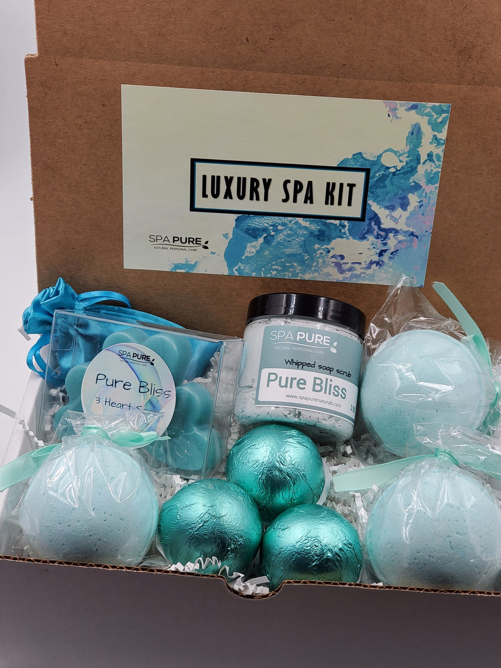 Spa Pure Luxury Spa Kit - Pure Bliss - 3 XL Pure Bliss Bath Fizzies, 3 Pure Bliss shower steamers, 3 Heart-shaped soaps, one 3.5 oz Pure Bliss whipped soap scrub, 1 Roll-on Perfume, Perfect for a mini-spa treatment.