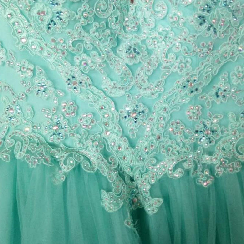 Adults in gowns, flowing skirts, confident display.