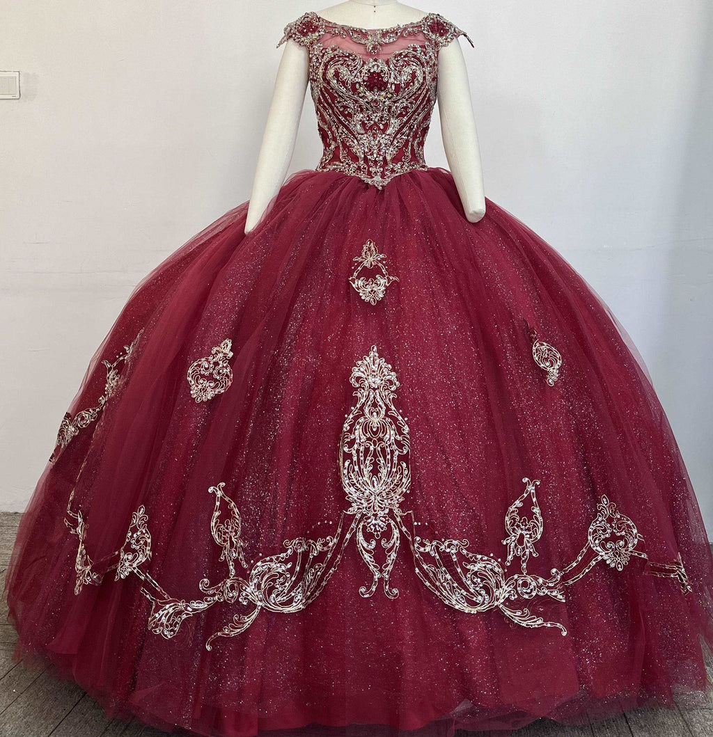 A beautiful gown, off-shoulder, reveals noble air.